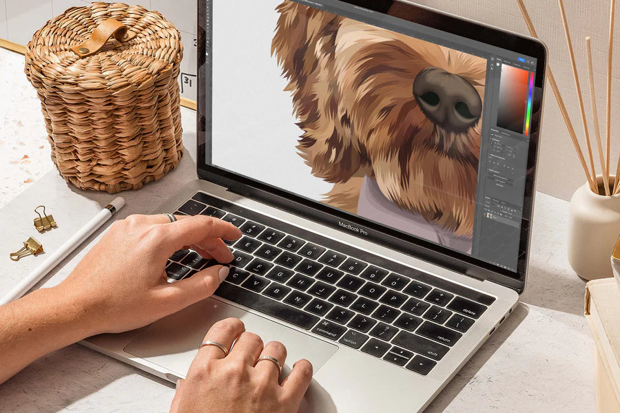 Illustrateur en train de redessiner un portrait de chien sur son ordinateur